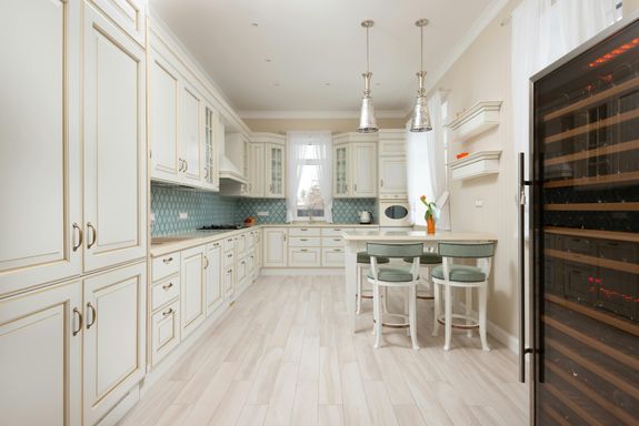 White wooden cabinets of expensive kitchen