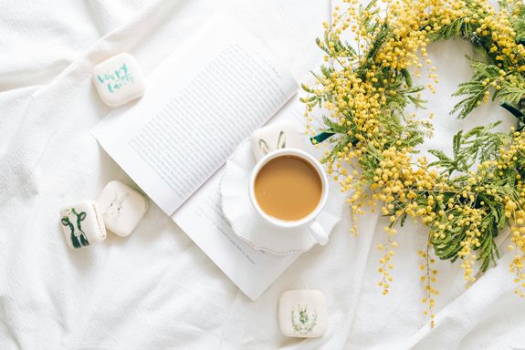 Cup of Coffee and a Wreath of Yellow Flowers