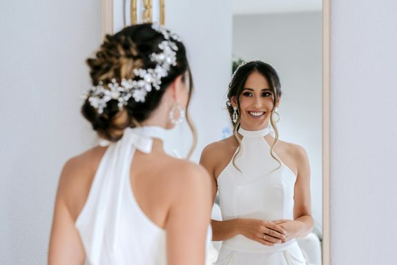 Bride Looking at Herself in a Mirror