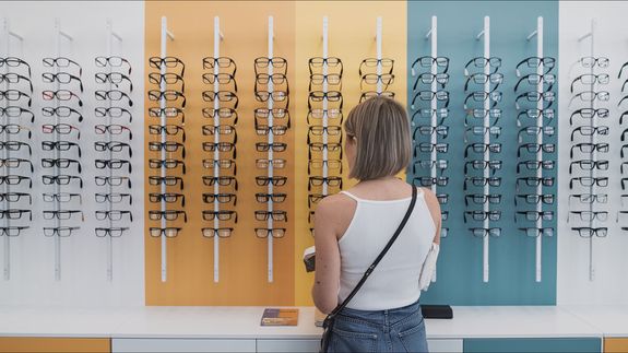 Serious woman wearing new eyeglasses