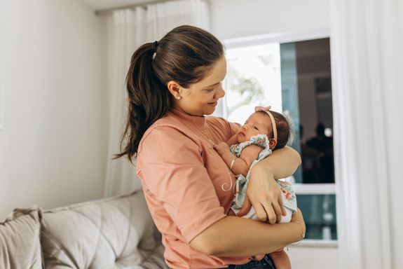Mother Embracing Her Baby Daughter