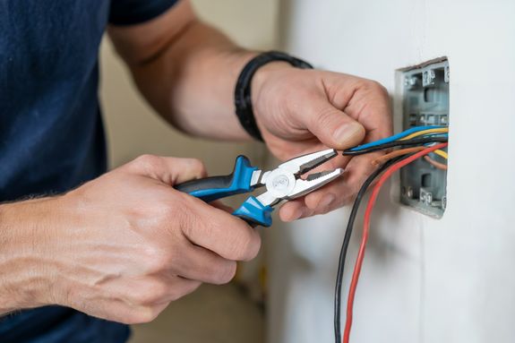 What should I consider before hiring an electrician?
