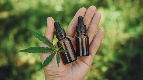 Person Holding White Plastic Bottle