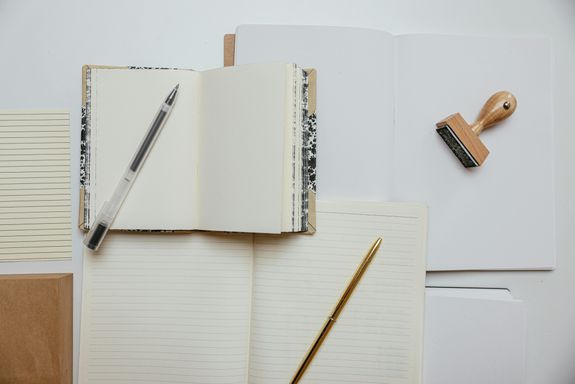 Pens on Top of Notepads 