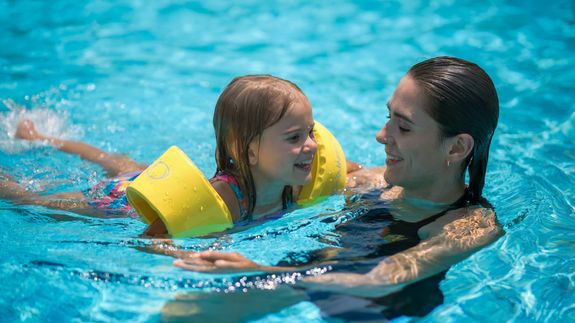 Person Swimming in Body of Water