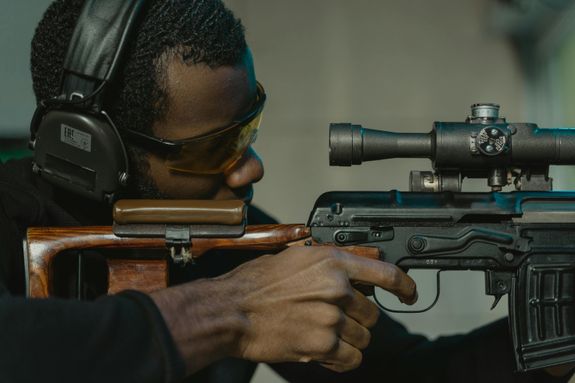 A Focused Man Aiming for the Target