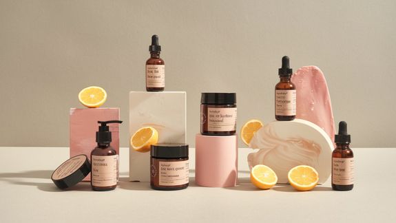 Woman Looking in Mirror Applying Face Mask