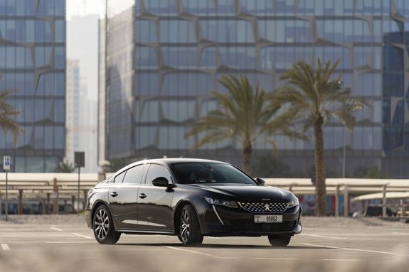 Black Mercedes Benz Coupe Parked Near Building