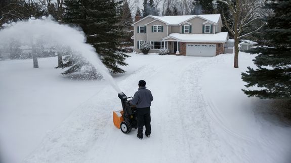 Person Working with Snowplow