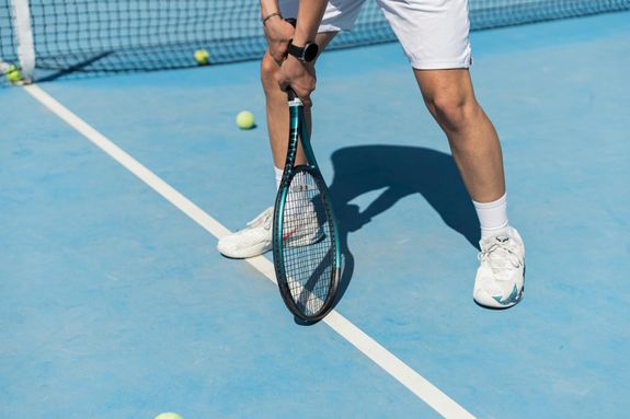 A Man Playing Tennis on the Court