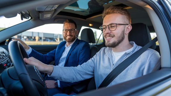 Man in White Dress Shirt Driving Car