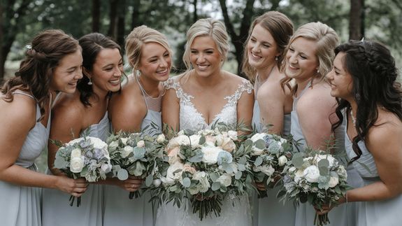 Fresh bouquet of flowers on table with floristry tools