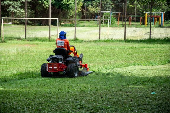Person Driving a Lawnmower