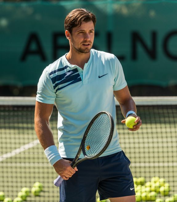 A Man Playing Tennis on the Court