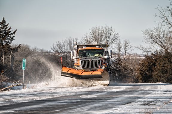 A Winter Service Vehicle Clearing the Road with Snow