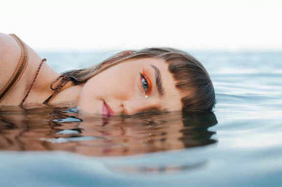 A Woman's Half Face on the Water 