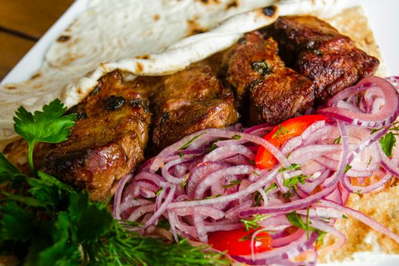 Close Up Photo of Cooked Meat and Sliced Onions