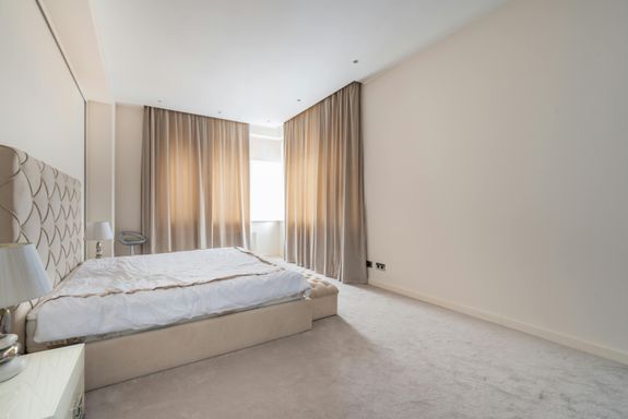 Spacious bedroom interior in pastel colors