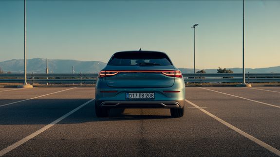 Man in White Dress Shirt Driving Car