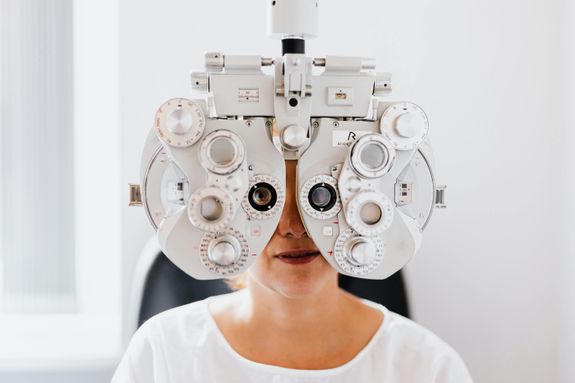 A Person in White Shirt Having an Eye Examination