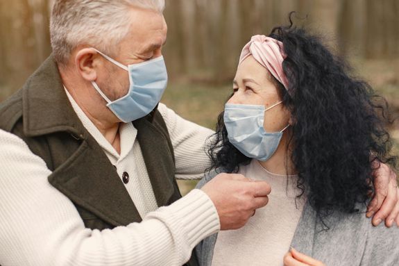 Photo of Man and Woman Wearing Face Masks