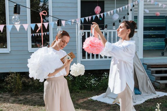 Woman in White Dress Holding Pink Flower Bouquet