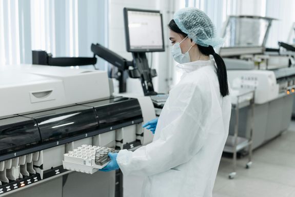 Medical Practitioner holding a Rack of Test Tube Samples