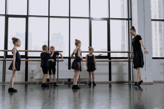 Young Ballerinas Dancing with their Teacher