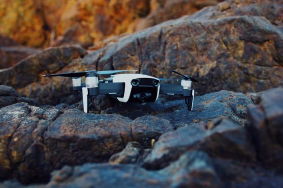 Shallow Focus Photography of White and Black Quadcopter Drone