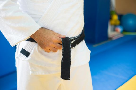A Person wearing Judo Uniform with Black Belt