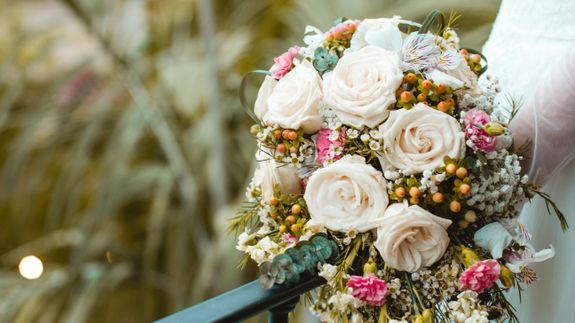 Woman Putting Ring On Person's Hand