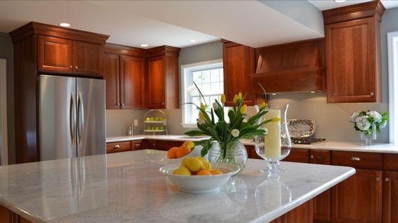 brown wooden framed yellow padded chair
