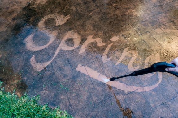 Red Car Being Washed by a Garage