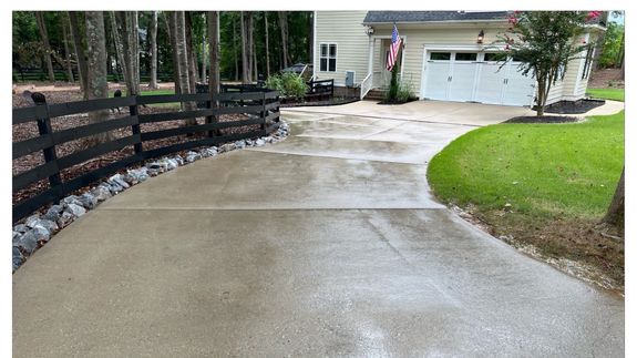 Red Car Being Washed by a Garage