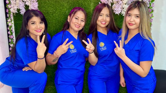 Barber Cutting Client Hair in Saloon