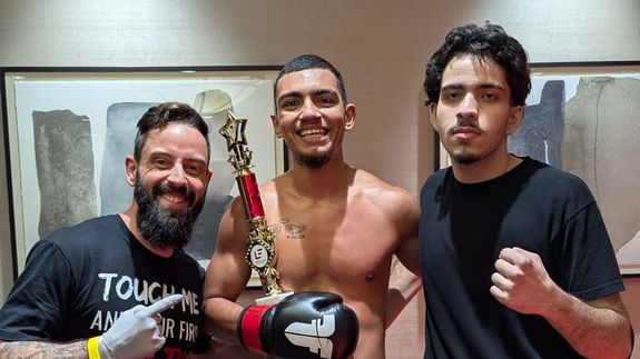 person about to touch the calm water