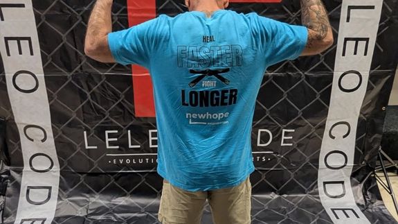 person about to touch the calm water