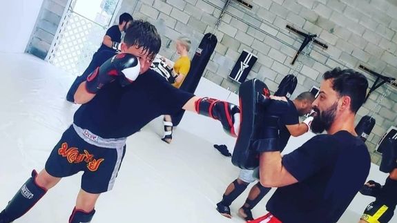 person about to touch the calm water