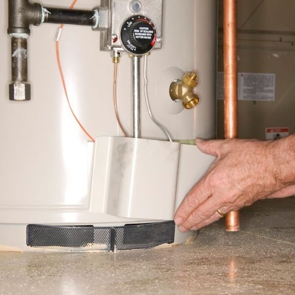 How do I know if my hot water tank needs to be repaired or replaced?