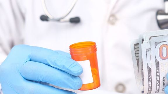 Real Estate Agent in Black Coat Discussing an Ownership Agreement to a Couple Inside  the Office