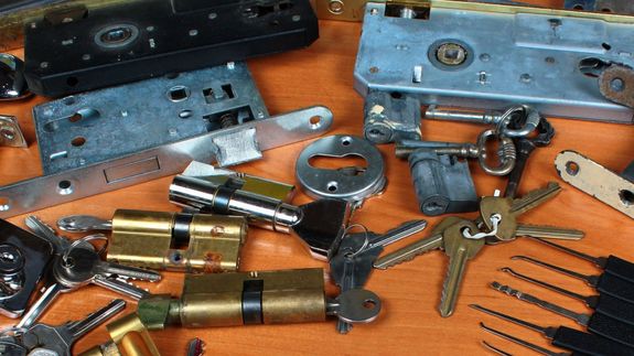 Person Holding on Door Lever Inside Room