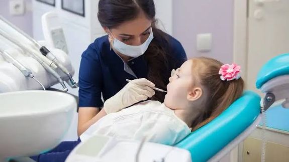 Dentist and Her Patient Posing at the Camera