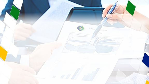 Stock Market Charts on Phone and Laptop