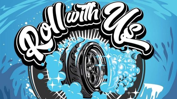 Detailed view of a white car's tail light in a moody outdoor setting.