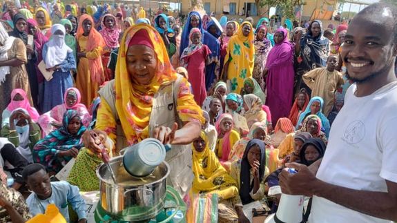 Woman in Pink Shirt Sitting on Brown Wooden Armchair