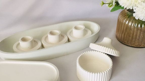 Woman Holding Lighted Votive Candle