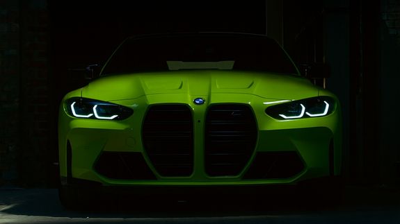 Close-up of a luxury white car highlighting its sleek design and headlight. Ideal for automotive enthusiasts.