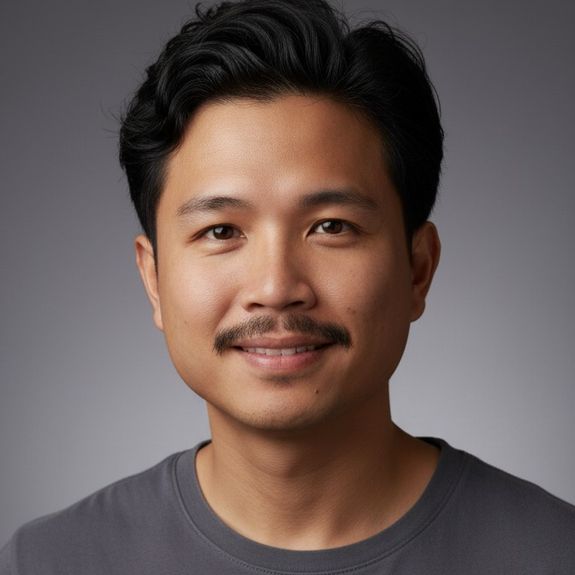 A woman photographer takes a picture indoors with festive lights and an American flag in the background.