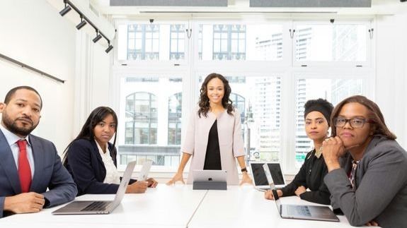 Woman in White Shirt Sitting on Chair