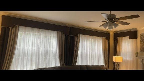 Woman in Pink Long Sleeve Shirt Holding Bouquet of Flowers